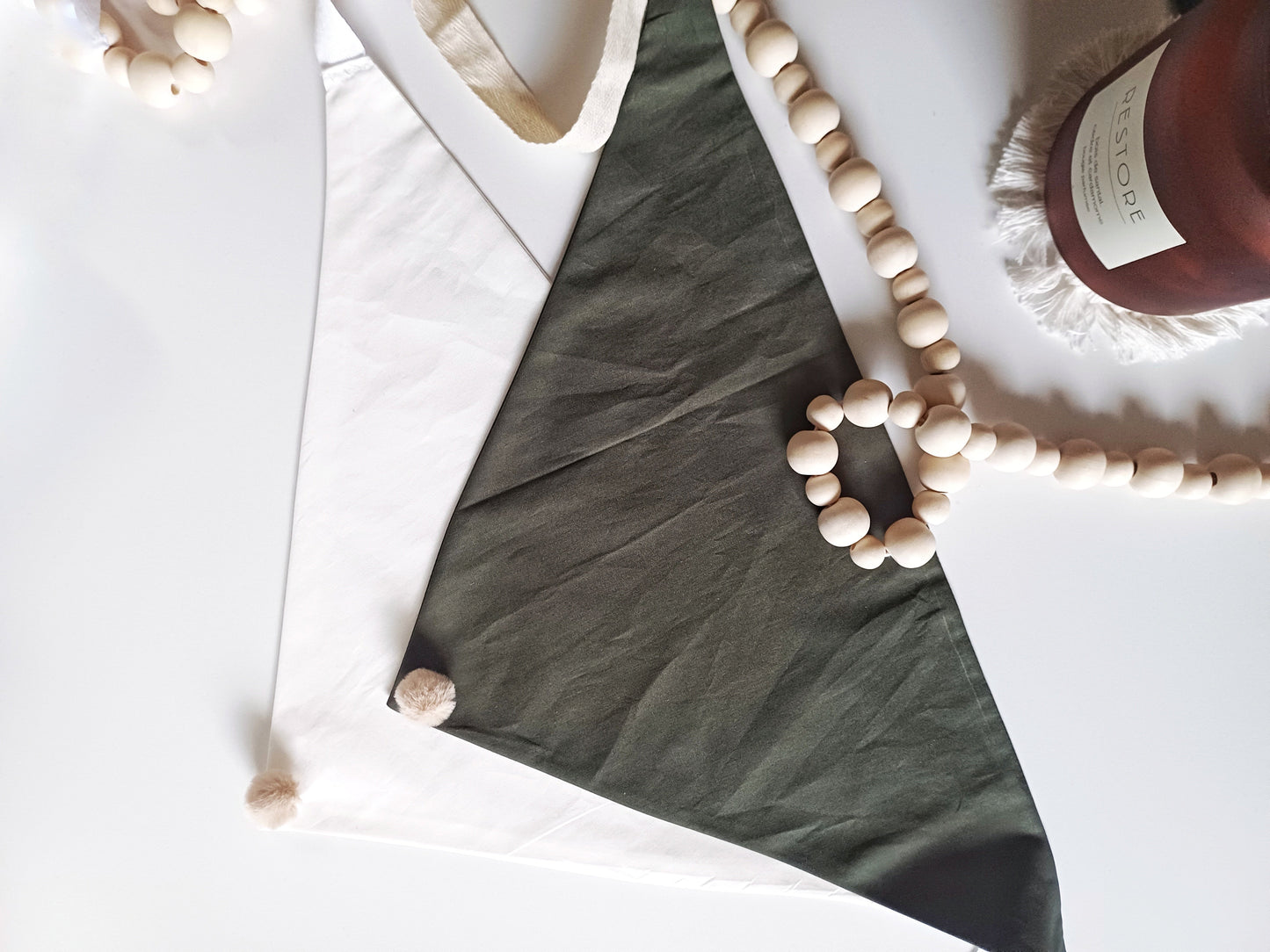Noémie, the small plain scarves with pompoms