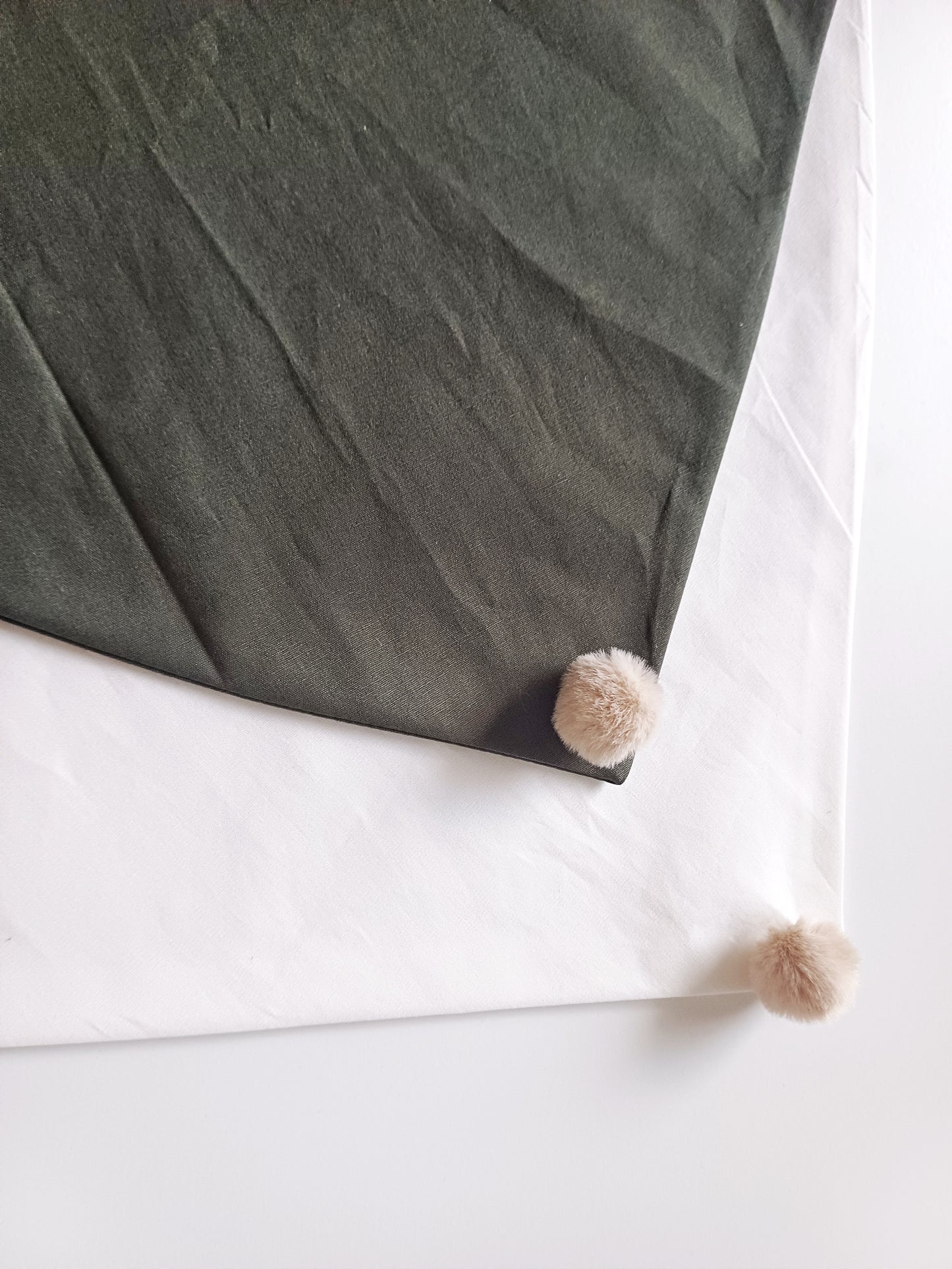Noémie, the small plain scarves with pompoms