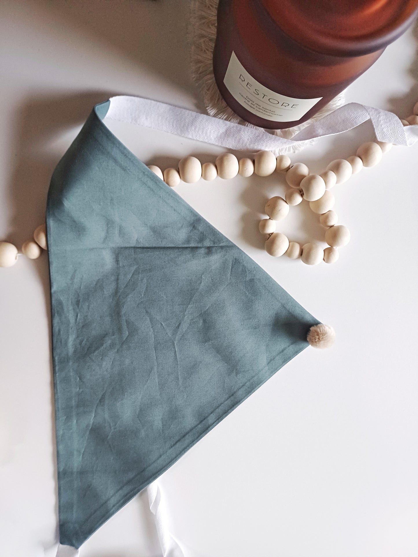 Noémie, the small plain scarves with pompoms