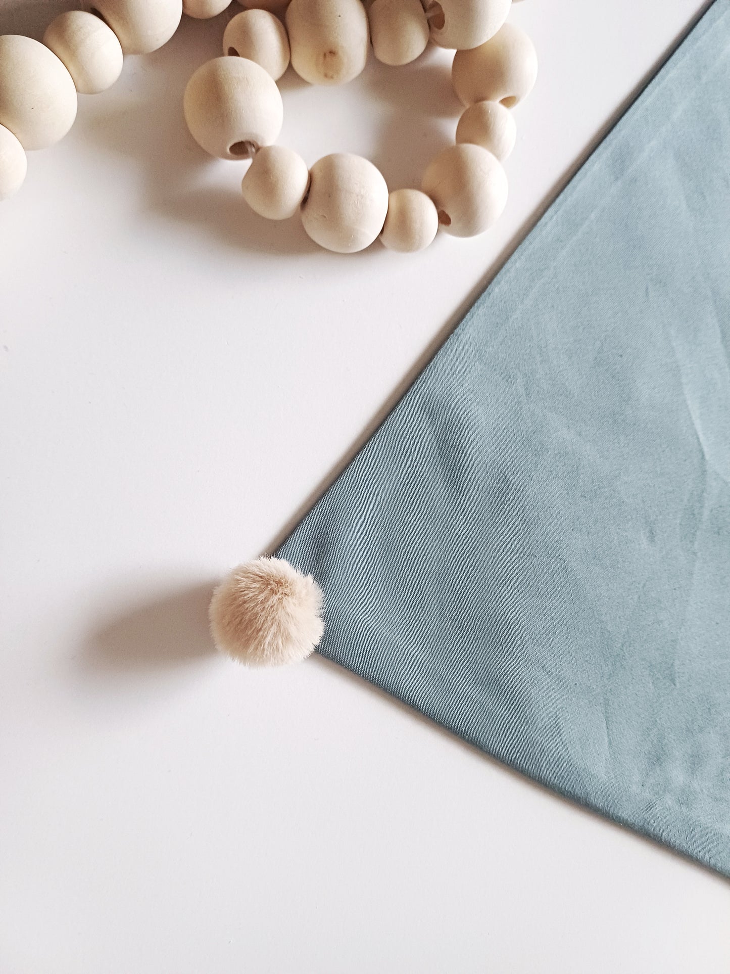 Noémie, the small plain scarves with pompoms