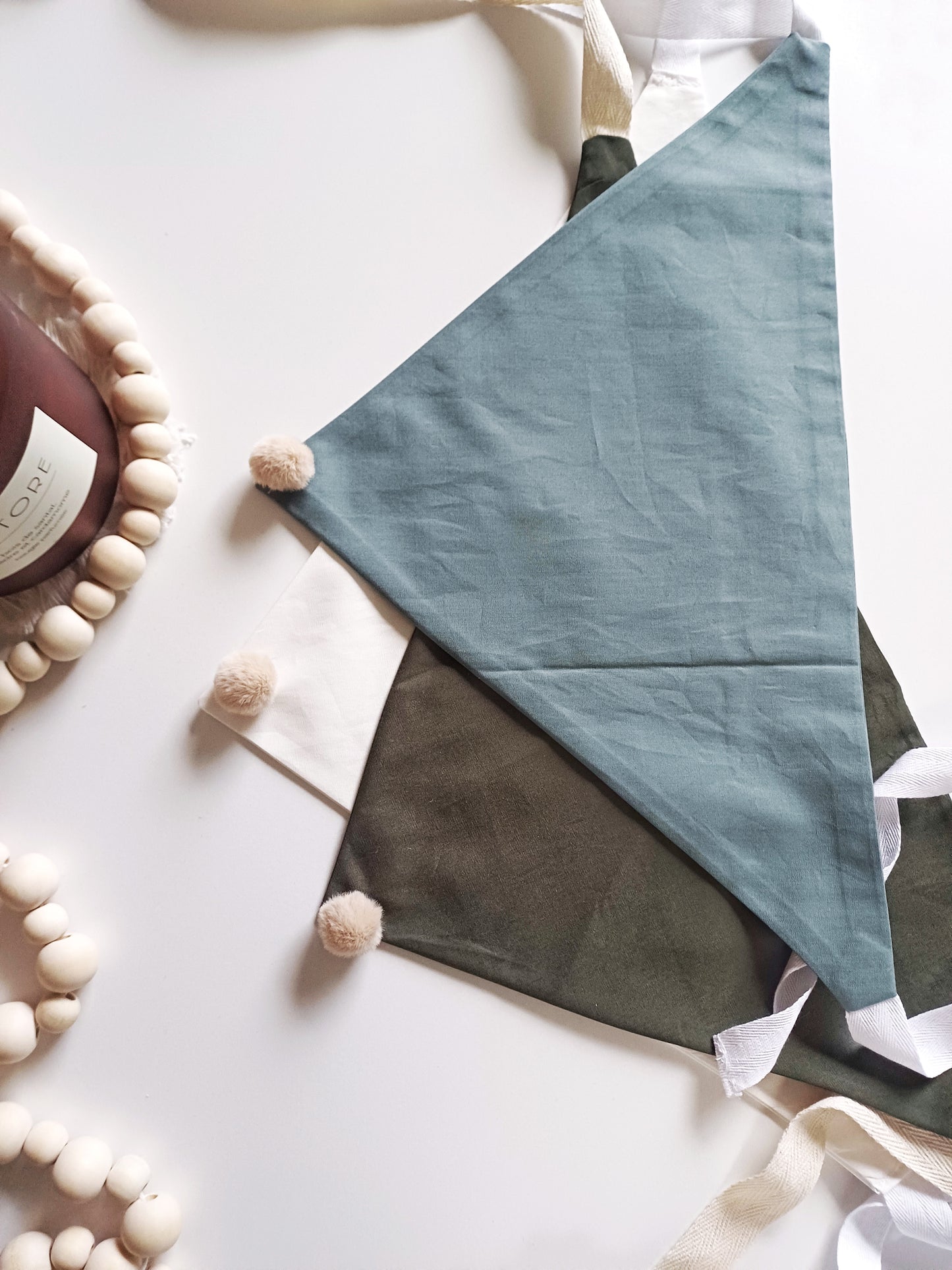 Noémie, the small plain scarves with pompoms