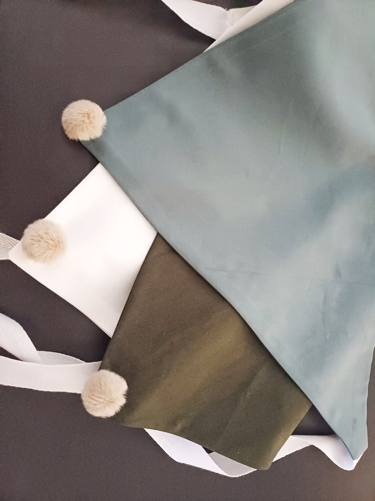 Noémie, the small plain scarves with pompoms